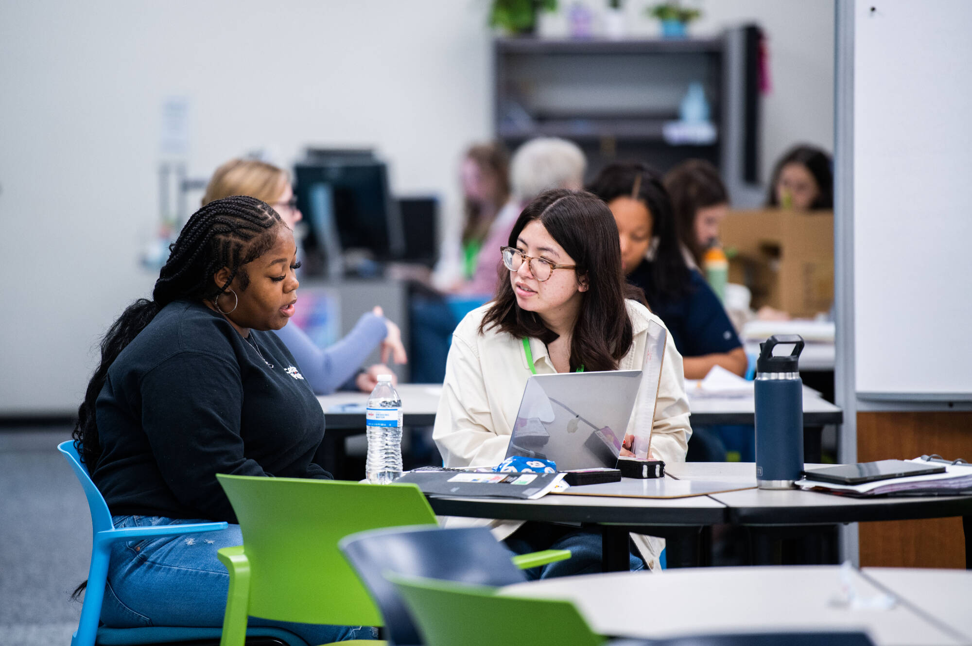 Angela Tran, right, tutors Jainell Denham Carter, left, in chemistry in the new Tutoring and Reading Center in Henry Hall September 27.(Photo releases on file)